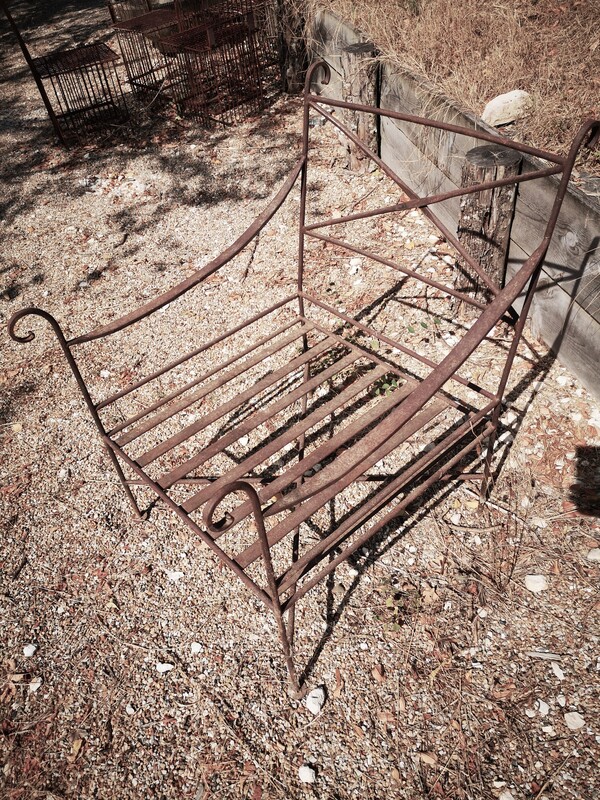 Pair of wrought iron garden armchairs