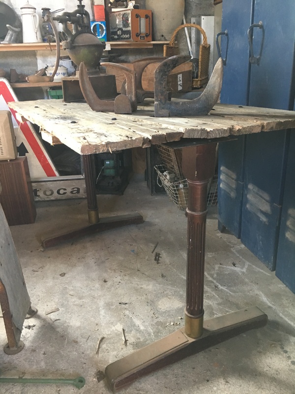 Old wooden and brass bistro legs