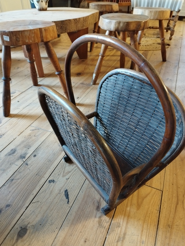 Old rattan magazine rack