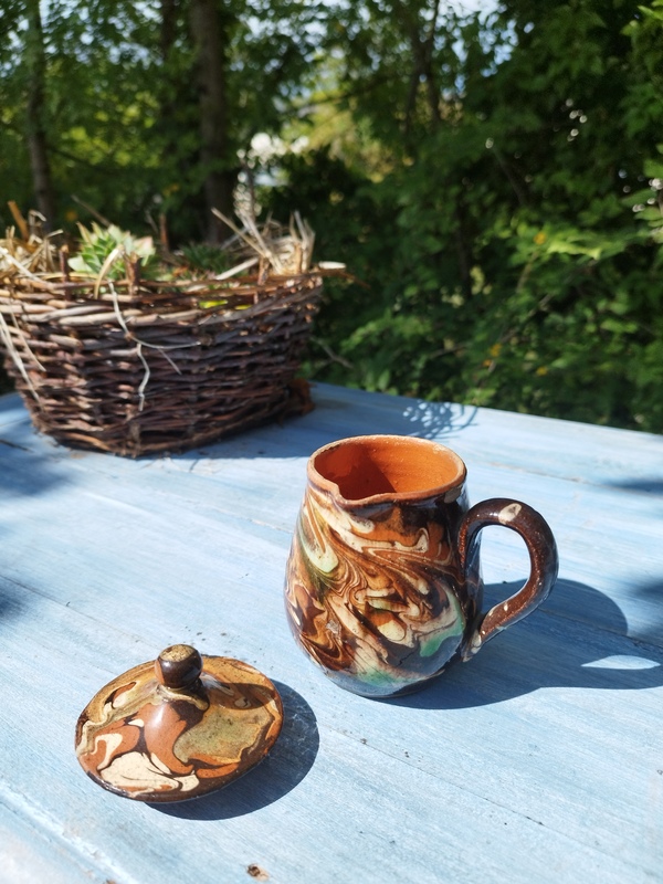 Glazed earthenware milk jug