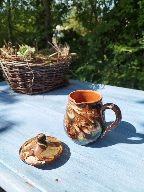 Glazed earthenware milk jug