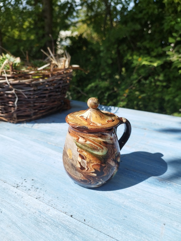 Glazed earthenware milk jug