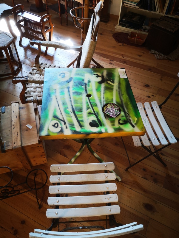 painted rusty tolix table