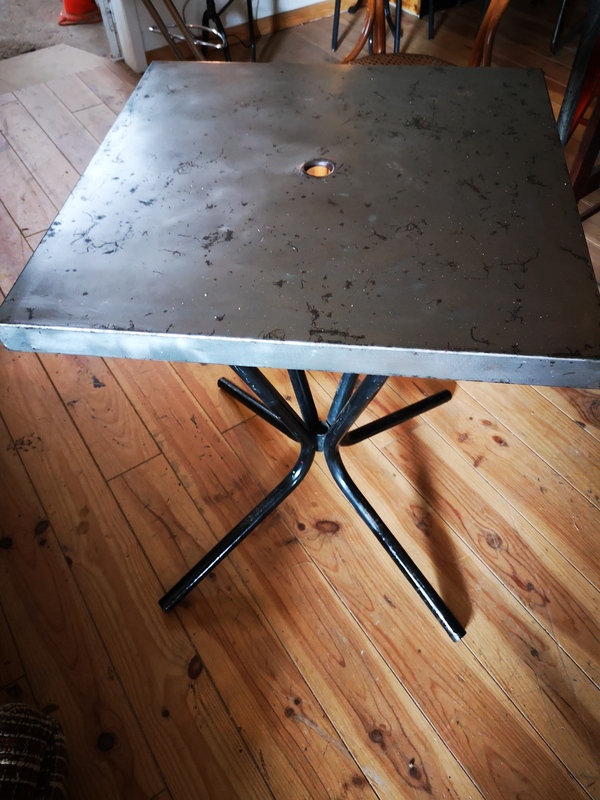 Stripped metal bistro table