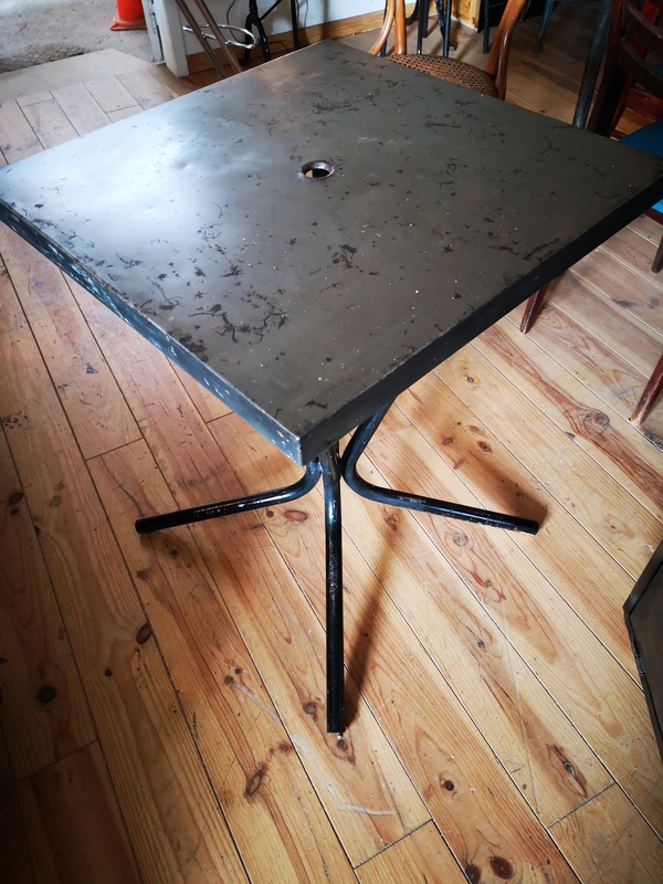 Stripped metal bistro table