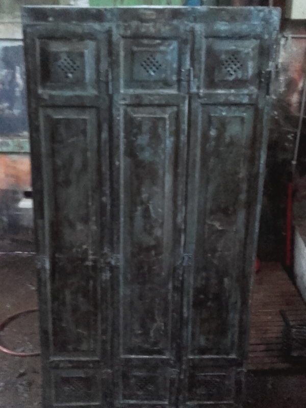 Locker room with three riveted doors and pressed sheet metal