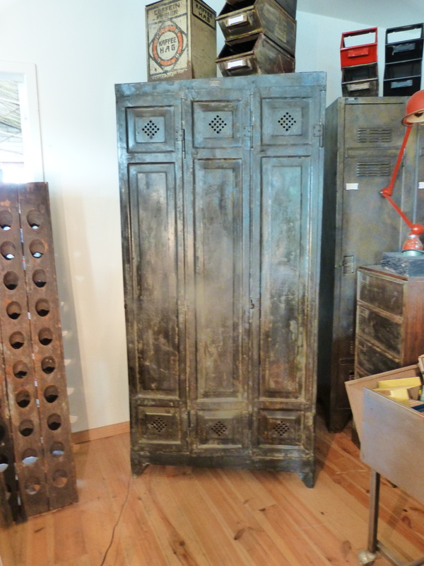 Locker room with three riveted doors and pressed sheet metal