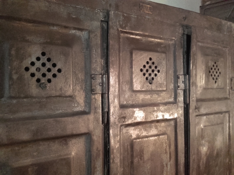 Locker room with three riveted doors and pressed sheet metal